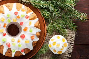 traditional decorated christmas cake at wooden table
