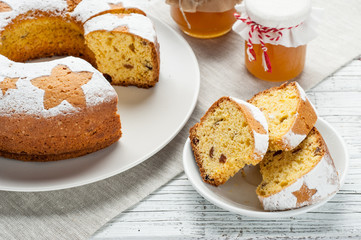 homemade traditional fruit cake slices at white wooden table
