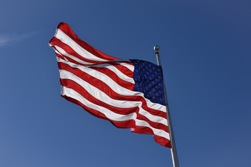 United states of America Flag with clear blue sky background