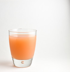 Isolated glass of Pink Grapefruit juice