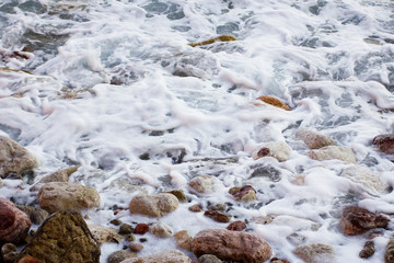 Sea foam and stones