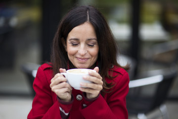 young woman enjoying coffee