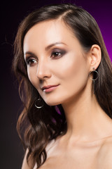 Obraz premium The beautiful girl portrait on a violet background