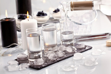 Festive buffet with vodka, black cavier and candles. Celebration concept for Christmas, new year or other party