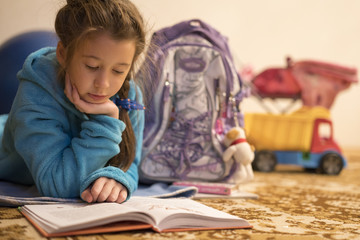 Schoolgirl reading homework
