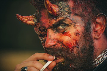 Halloween devil smoking cigarette