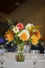Wedding Photography: Fall Wedding Centerpieces on a White Table Indoors