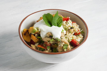 Moroccan salad with chicken, bulgur, pumpkin and goat cheese