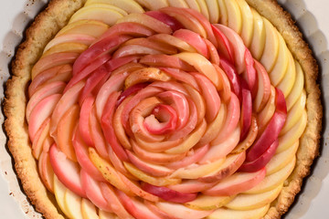 Fototapeta na wymiar Rose made of apples as filling for beautiful homemade rose pie