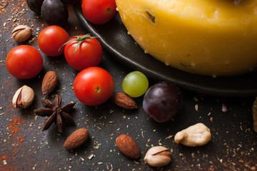 Healthy food. Recipe of italian cuisine. Gourmet sorts of cheese with sweet pepper on spicy black background