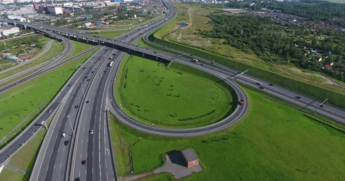 Lines and curves of intercharges of urban ring road are in south of Saint-Petersburg city, Russia. Aerial view