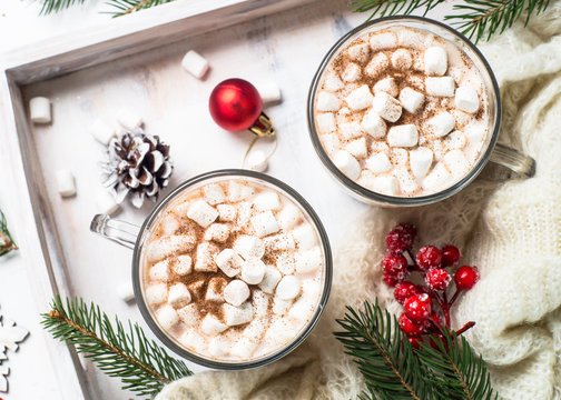 Christmas hot chocolate or cocoa with marshmallow on white.
