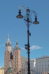 Fototapeta na wymiar Mary's Church and lampstreet in Main Market in Krakow