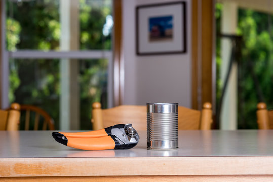 Metal Can With Opened On The Counter Top