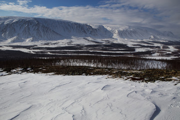 River valley in the snowy mountains. The River Sob. Polar Urals. Russia.