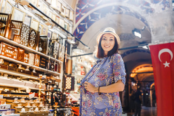 Young girl tourist walking in the old souvenir market in Istanbul, Turkey