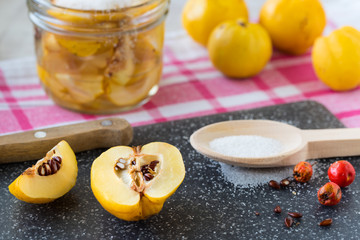 Fresh quince fruits and syrup homemade.