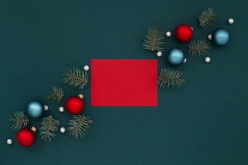 Red card and Christmas decoration on shaded spruce