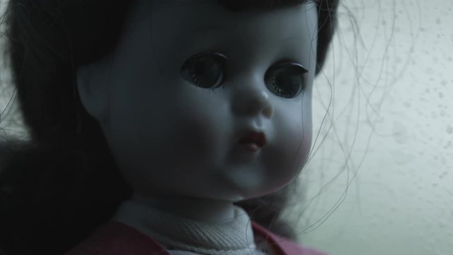 Creepy vintage doll close up.