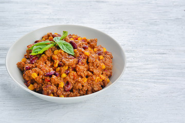 Chili con carne in plate on table