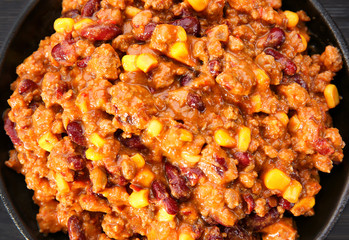 Chili con carne in frying pan on table