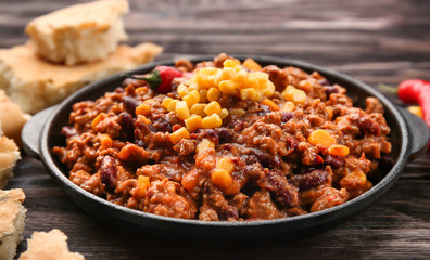 Chili con carne in frying pan on table