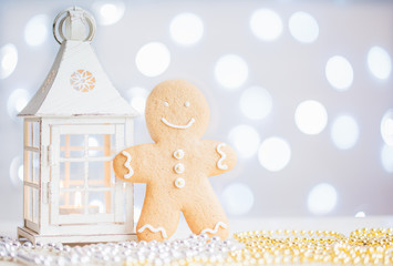 Christmas lantern, man cookie on and ball. holiday lights bokeh background