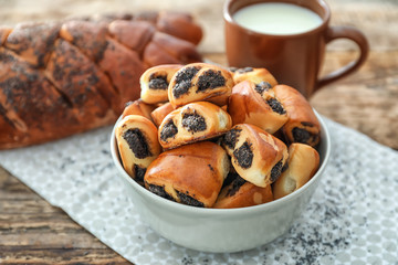 Tasty pastry with poppy seeds in bowl