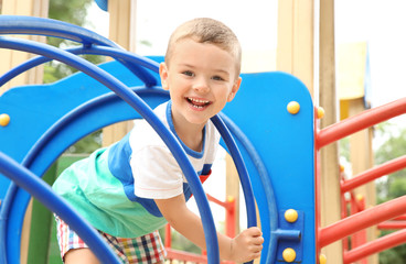 Obraz premium Cute little boy on playground