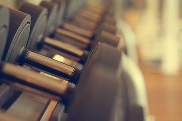 Plakat Rows of dumbbells in the gym