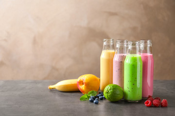 Bottles with different protein shakes on table