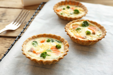 Tasty salmon tartlets on parchment