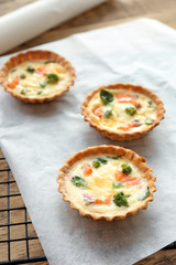 Tasty salmon tartlets on parchment