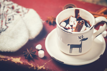 Hot Chocolate with Marshmellow candies. Warming holiday drink with cinnamon sticks . Warm Christmas.Winter Still Life in the Cup.