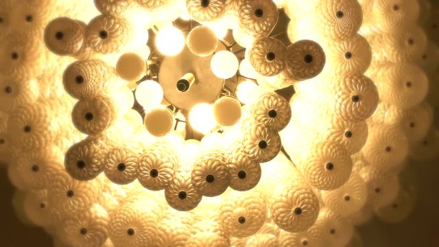 Chandeliers spiral to soft light yellow like a dream.

