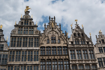 Obraz premium Vernacular Belgian architecture with Dutch stepped gables surrounding the Grote Markt in Antwerp, Belgium on a cloudy summer day.