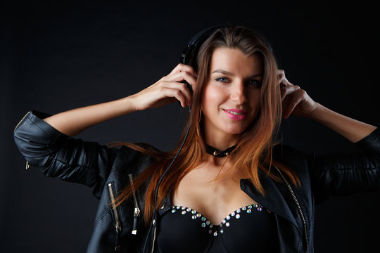 Picture of beautiful girl in headphones with leather jacket