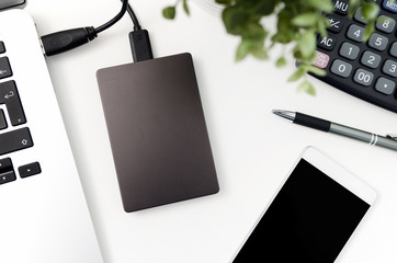 External backup disk hard drive connected to laptop