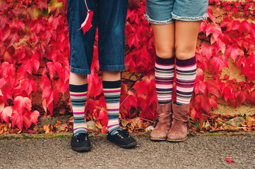 Image of kids legs wearing stripe high socks © annanahabed