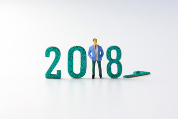 2018 New year concept business man miniature figures standing on 2 0 1 8 number on white background