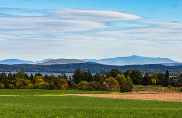 Fototapeta na wymiar landscape of countryside on Grand Isle, one of the Lake Champlain Islands with Green Mountains of Vermont across the lake 