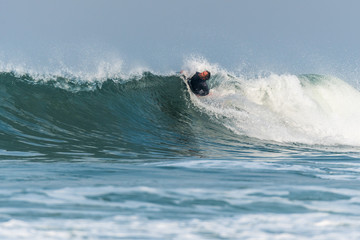 Bodyboarder surfing ocean wave