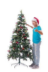 Young man decorating christmas tree isolated on white