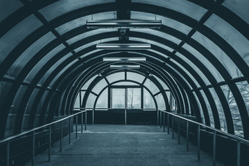 Abstract hallway interior of building. Interior of modern building. Abstract view of building. Long walk in building. Steel and glass building. Sunshine on building. Sunshine on windows of building.