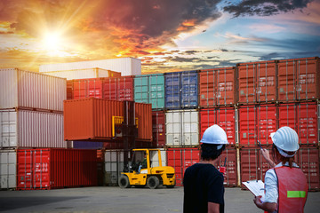 Two asian dock worker control, Forklift handling container box loading and Container Cargo freight...