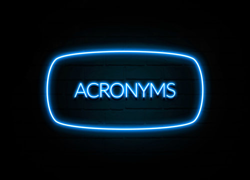 Acronyms  - colorful Neon Sign on brickwall