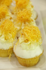 Collage of various cupcakes: vanilla