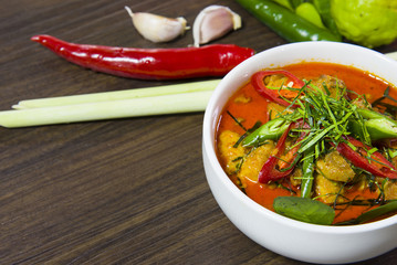 Delicious chicken panang curry and ingredient spice on wooden background, thai food, selected focus.