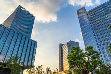 low angle view of skyscrapers in city of China at dusk