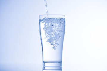 pouring water into glass